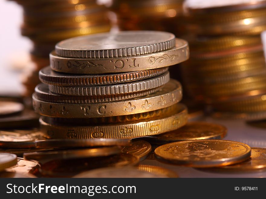 Golden piles of coins closeup