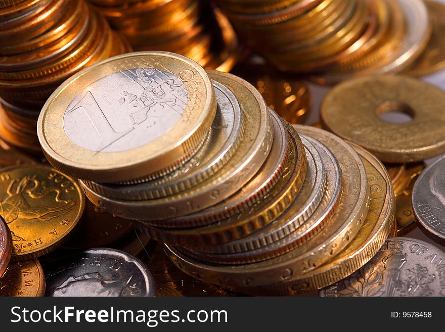 Golden piles of coins closeup