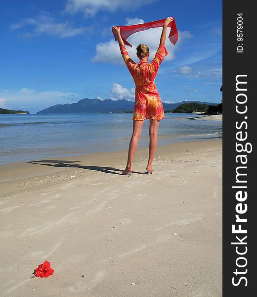 Young woman on a sandy beach. Langkawi, Malaysia
