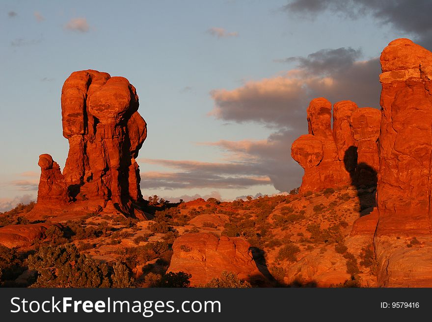 A beautiful fall evening at Arches National Park Moab, Utah. The setting sun just lights up the red rock. A beautiful fall evening at Arches National Park Moab, Utah. The setting sun just lights up the red rock.