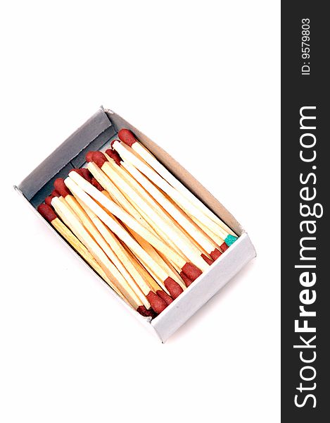 Matchsticks in match box isolated on white background.