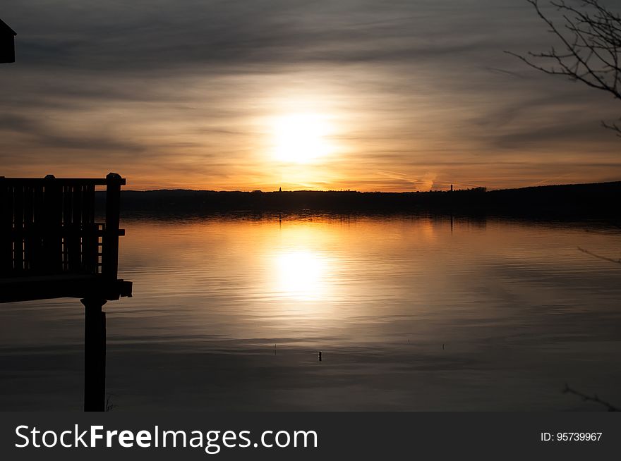 A sunset over a lake. A sunset over a lake.