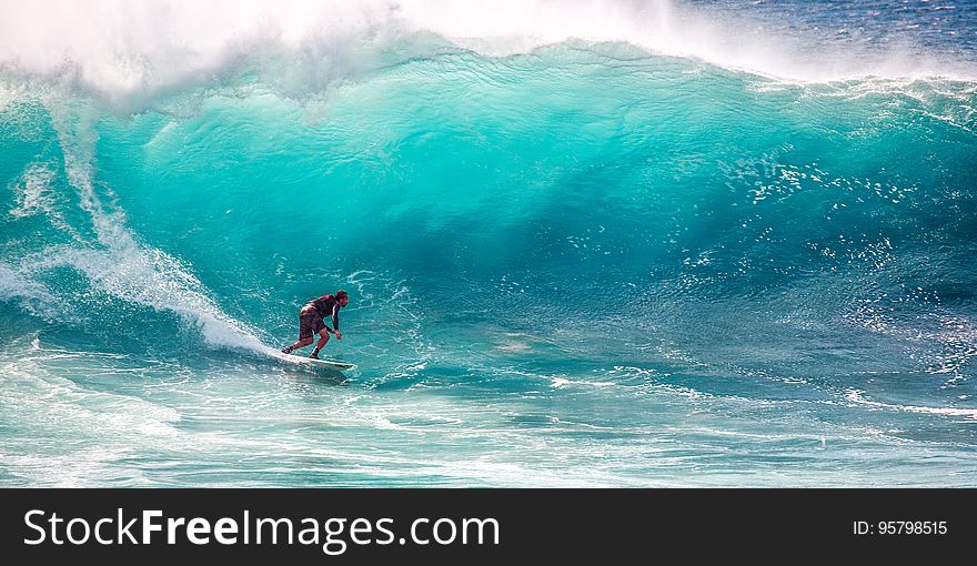 A surfer hitting the waves.