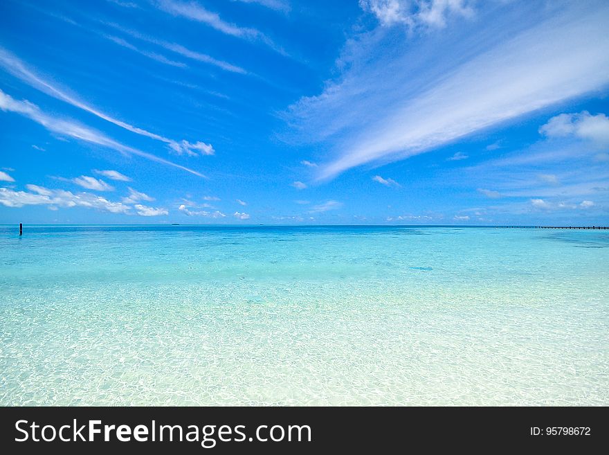A view of a tropical sea with blue skies.