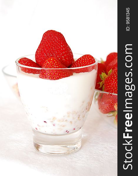 Strawberries, yogurt and muesli in a glass. Strawberries, yogurt and muesli in a glass