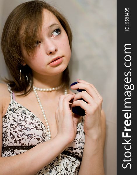 Girl holds the blue sheath with a ring. Girl holds the blue sheath with a ring