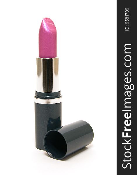 Single pink lipstick with the lid on a white background. Single pink lipstick with the lid on a white background