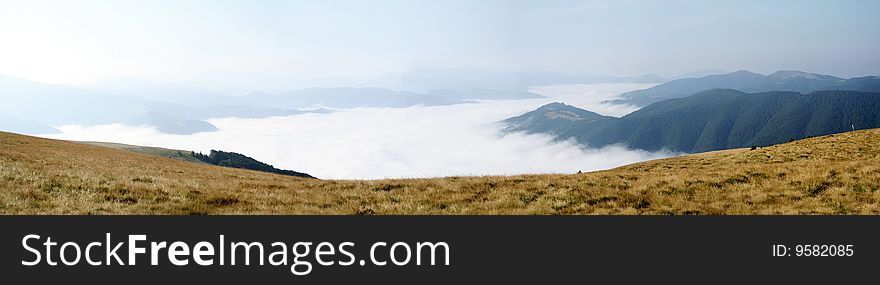 Mountain Valley Covered With Fog