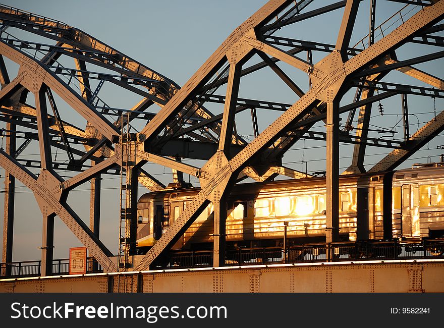 The express train on the bridge across Daugava river. The express train on the bridge across Daugava river.