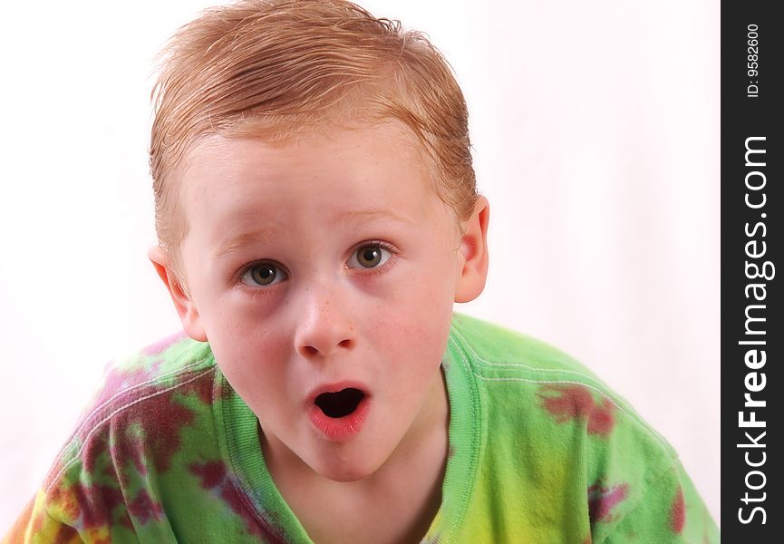 Portrait of young boy with surprised expression on face. Portrait of young boy with surprised expression on face