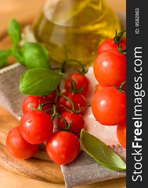 Cherry tomatoes with fresh basil and olive oil. Cherry tomatoes with fresh basil and olive oil
