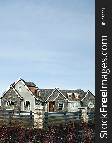 New home exterior with a blue sky background. New home exterior with a blue sky background