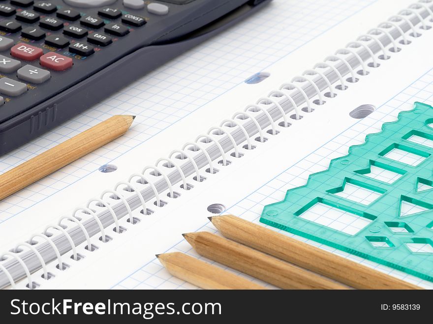 Spiral notebook with blue grid. Selective focus