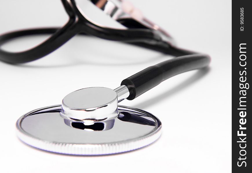 Medical stethoscope close-up on white background