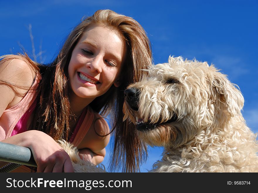 Teenager with her wheaten terrier dog. Teenager with her wheaten terrier dog