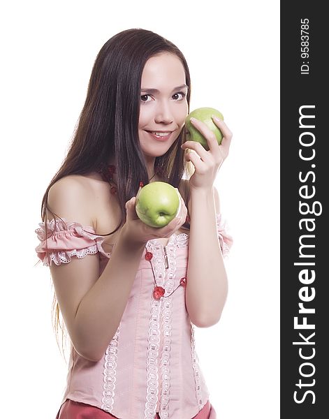Brunette girl with three green apples