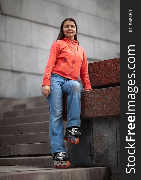 Portrait of rollerskating girl on granite stairs - shallow DOF