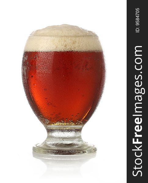 Cold glass of beer over white background