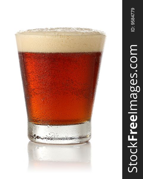 Cold glass of beer over white background