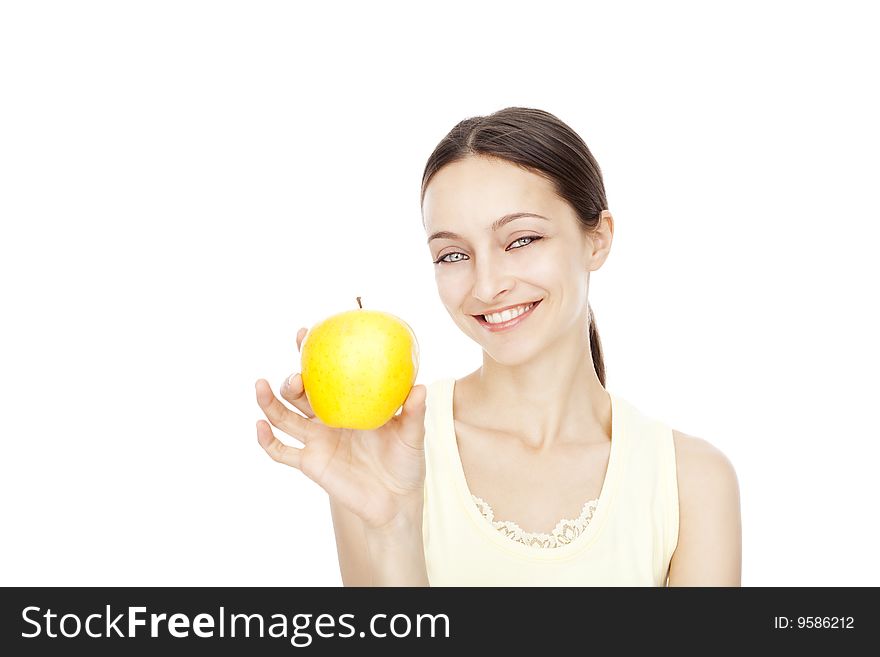 Young happy woman holding yellow apple isolated over white background