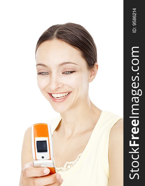 Young woman reading text messages on cellphone over white background