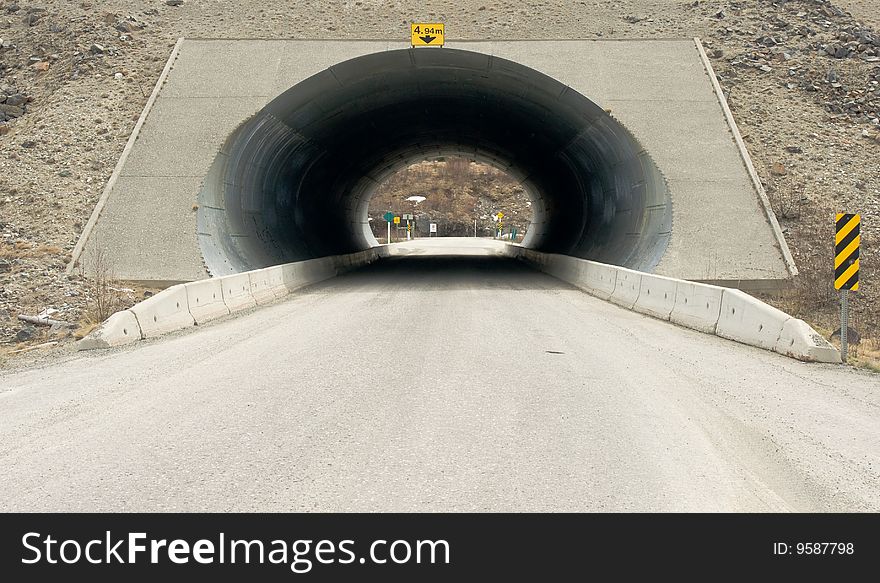 An underpass enabling vehicles to cross under one side of a highway to another. An underpass enabling vehicles to cross under one side of a highway to another