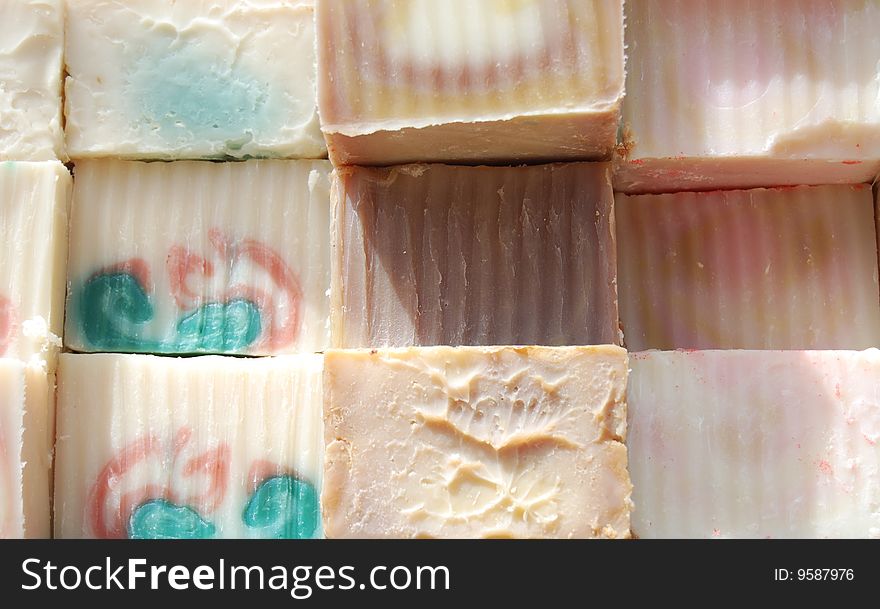 Stacks and rows of colorful handmade soaps