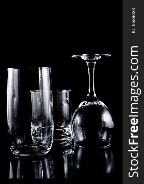 Empty cocktail glasses on black
