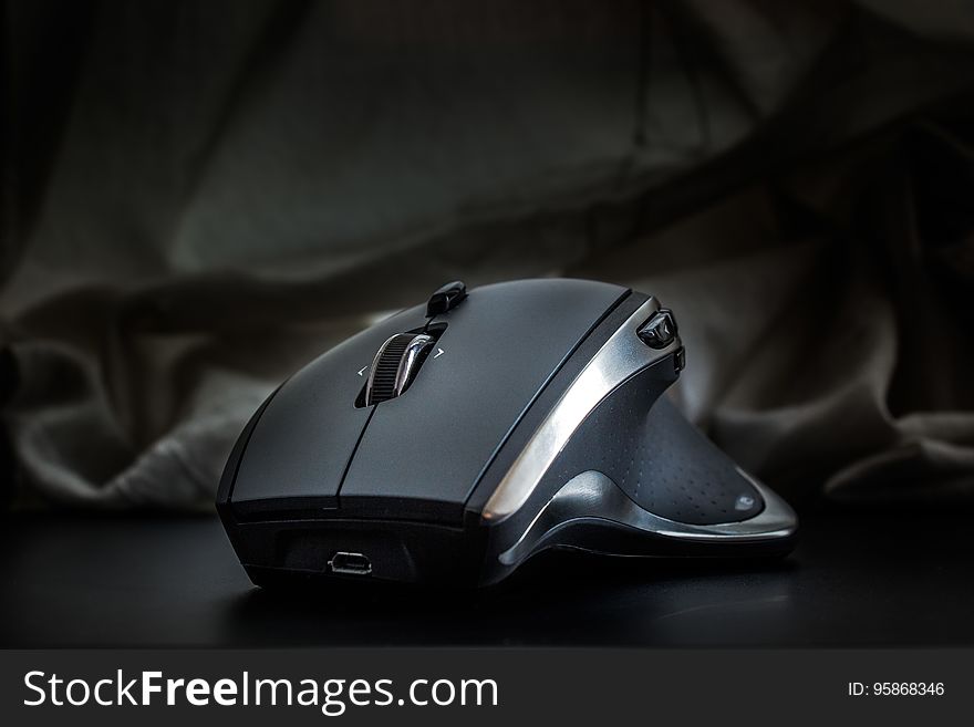 A close up of an anatomically shaped computer mouse. A close up of an anatomically shaped computer mouse.