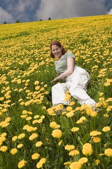 Young Lady In The Meadow Full Of Flowers Royalty Free Stock Photos