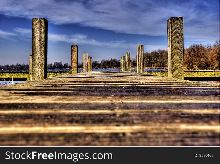 Landing stage for boats at The Vlietlanden, Holland taken from a low wide-angle