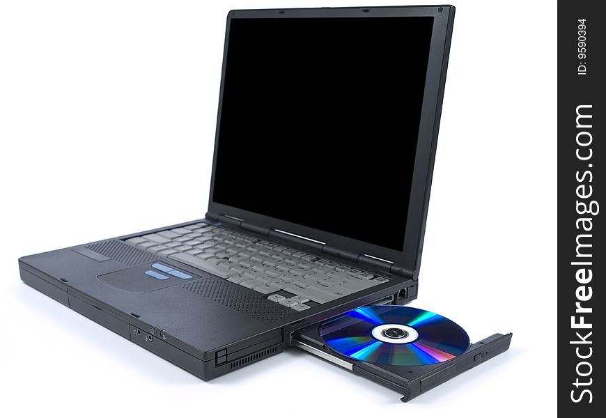 A black laptop with dvd in tray. Isolated over white background. A black laptop with dvd in tray. Isolated over white background.