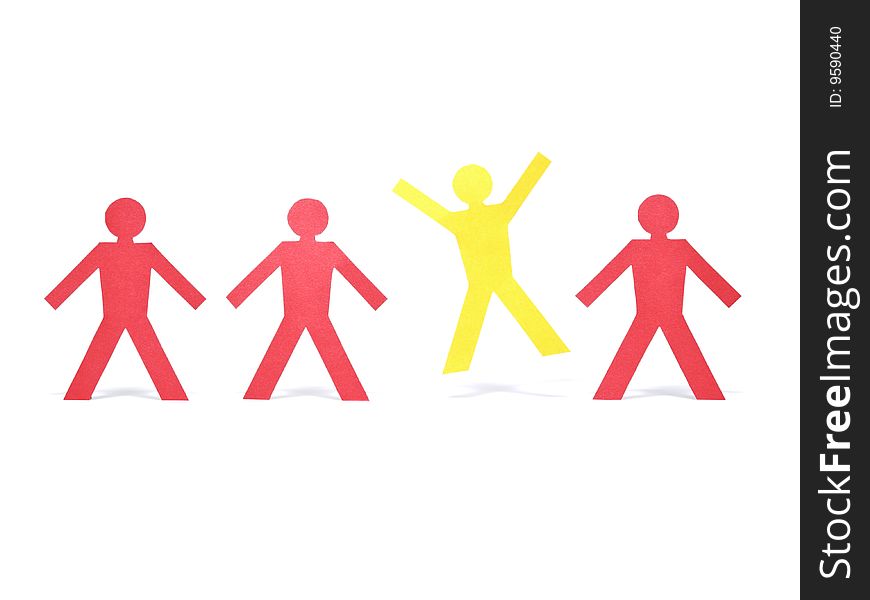 A yellow paper figure is celebrating between other red paper figures. A yellow paper figure is celebrating between other red paper figures.