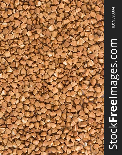 Dried brown buckwheat, texture, background. Dried brown buckwheat, texture, background