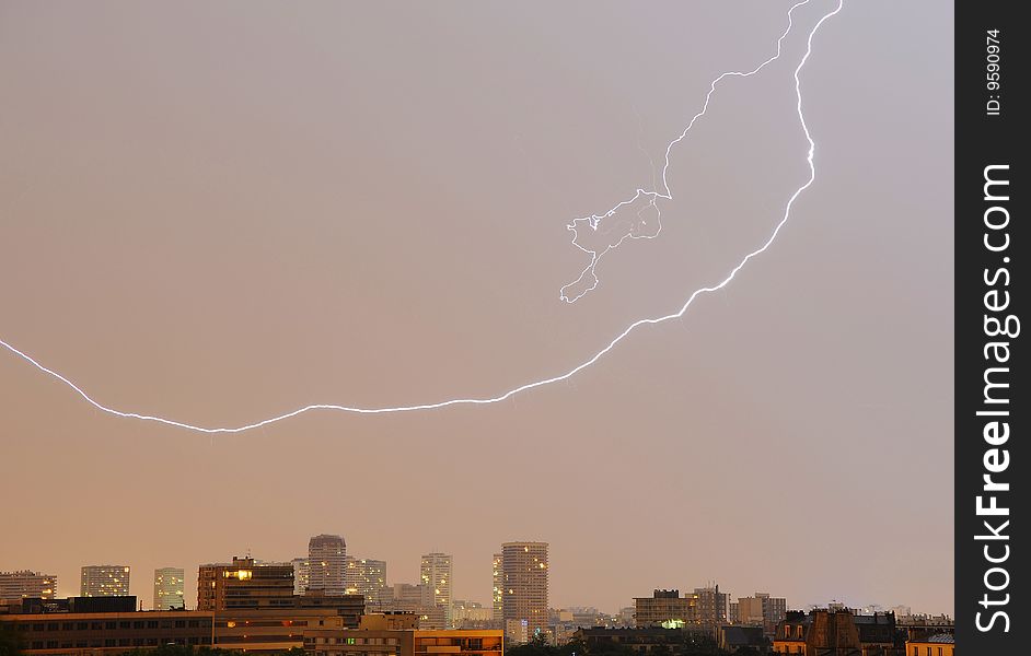 A rendering of a lightning strike with buildings on background
