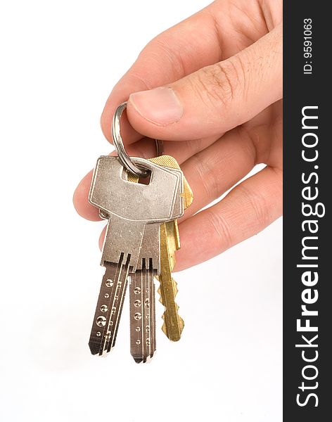 Hand holding keys - isolated on white background