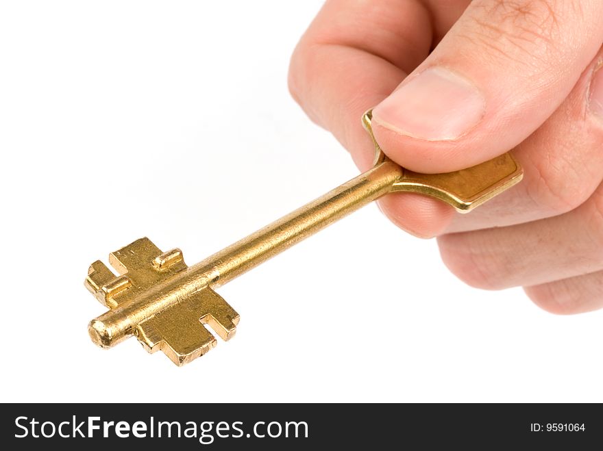 Hand with key isolated over white background