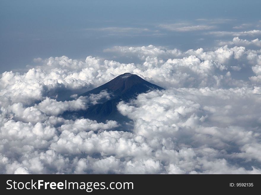 Panoramic view to the Sundoro volcano from the airplane on Java, Indonesia. Panoramic view to the Sundoro volcano from the airplane on Java, Indonesia
