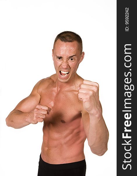 Young man in fight action on the white background