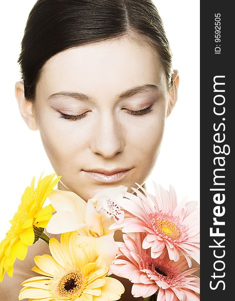 Portrait of young woman with several flowers. Portrait of young woman with several flowers