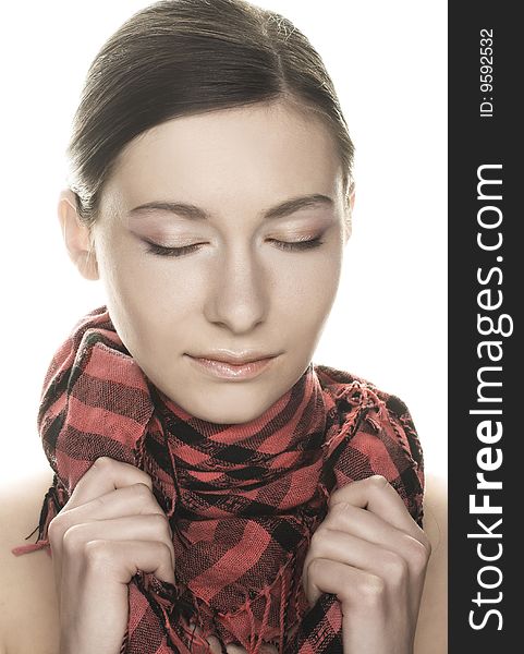 Portrait of  pretty young woman in pink and black scarf