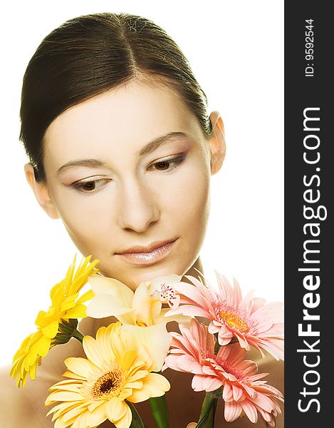 Portrait of young woman with several flowers. Portrait of young woman with several flowers