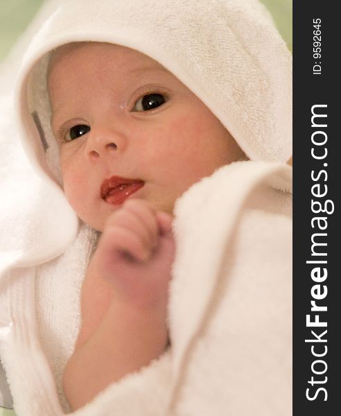 Three-month old baby girl in towel