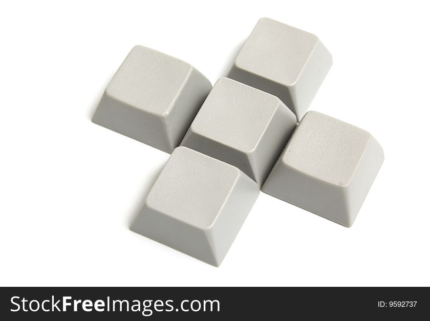 The cross from computer buttons is isolated on a white background. Clipping pach includet.