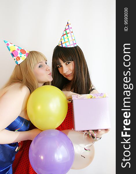 Young pretty woman in birthday cap with present box. Young pretty woman in birthday cap with present box