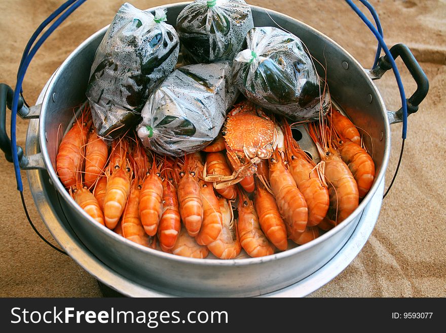 Royal prawns in aluminum saucepan on song