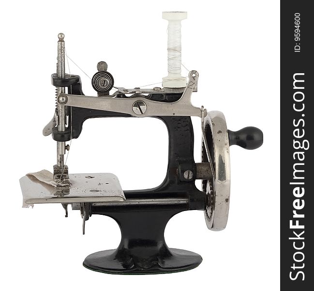 Old historical sewing machine, isoliated against white background