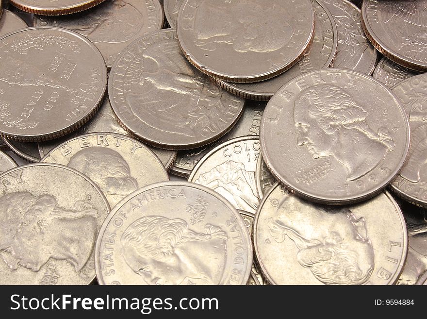 A background of U.S. quarters makes a nice monetary display. A background of U.S. quarters makes a nice monetary display.