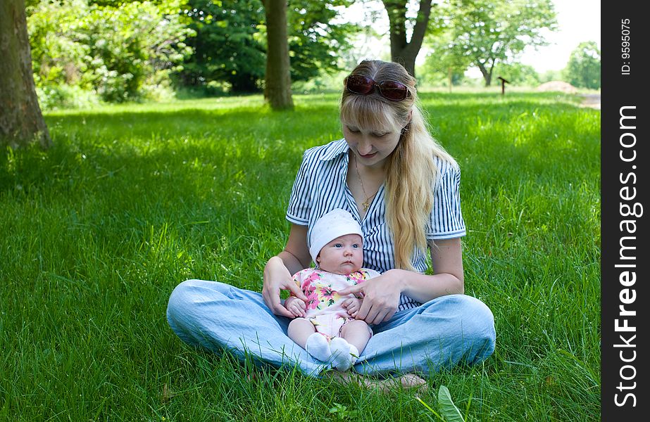 Baby in Mother s Lap Outdoors