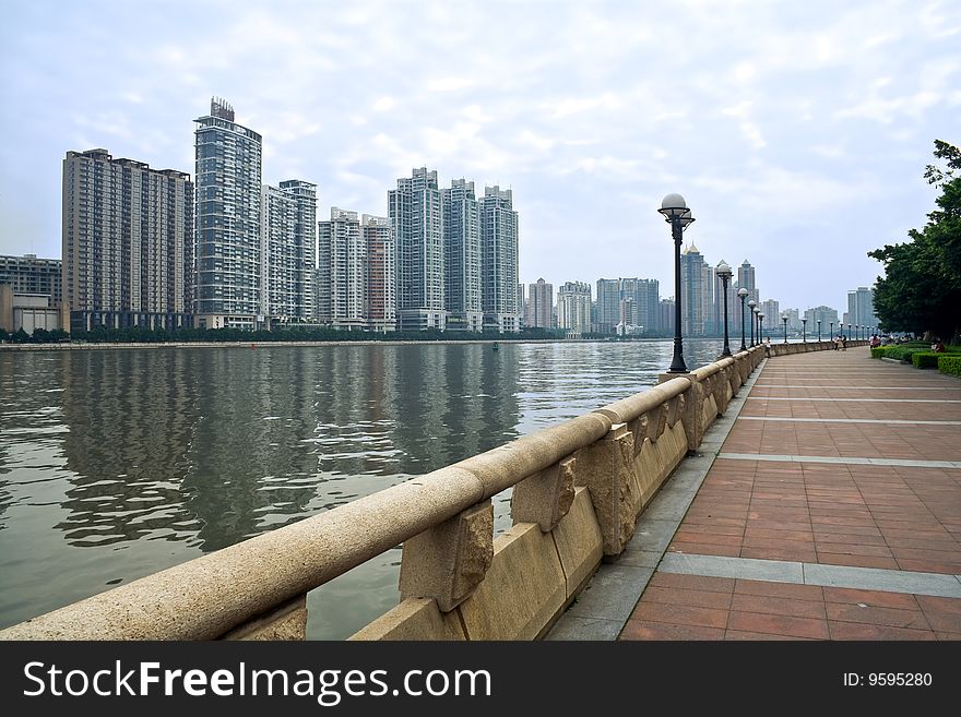 Modern residence buildings,river and embankment of city. Modern residence buildings,river and embankment of city
